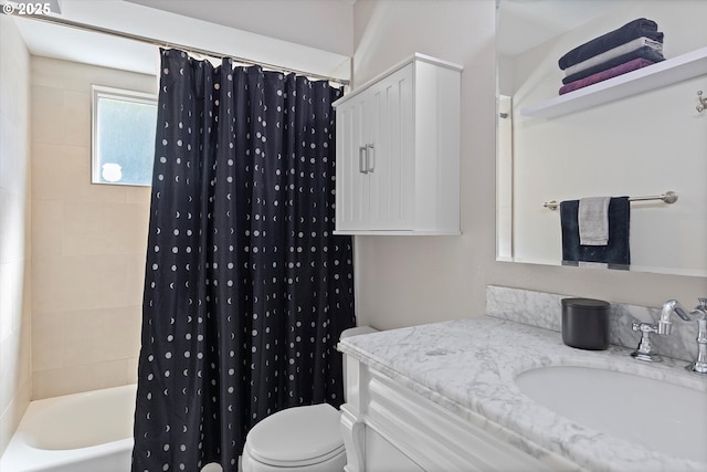 bathroom featuring toilet, vanity, and shower / bath combo