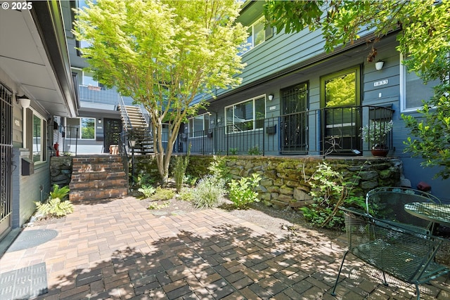 view of patio / terrace featuring stairs