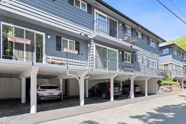 view of property featuring covered parking
