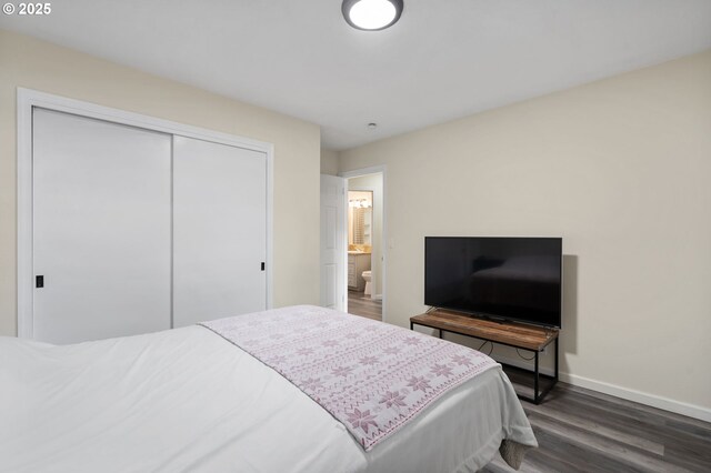 4220 SE 130th Ave, Portland, OR 97236 - bedroom with dark wood-style flooring and a closet