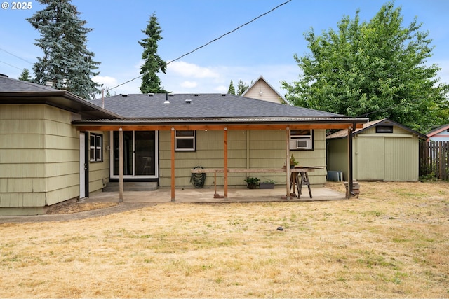 4220 SE 130th Ave, Portland, OR 97236 - rear view of property featuring a patio area, roof with shingles, and a storage unit