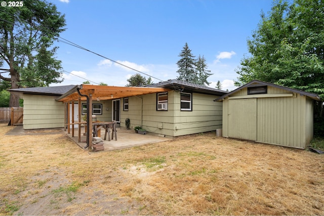 4220 SE 130th Ave, Portland, OR 97236 - rear view of property featuring a patio area and a storage shed