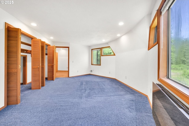 unfurnished bedroom with carpet flooring, recessed lighting, and baseboards