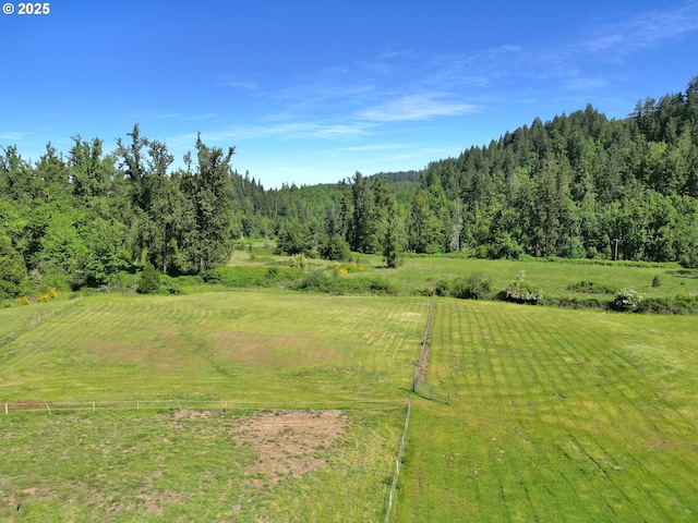 view of wooded area with a view of countryside