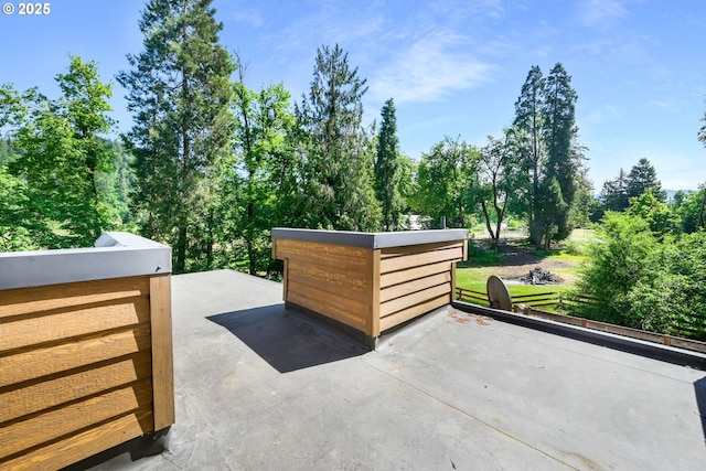 view of patio with view of wooded area