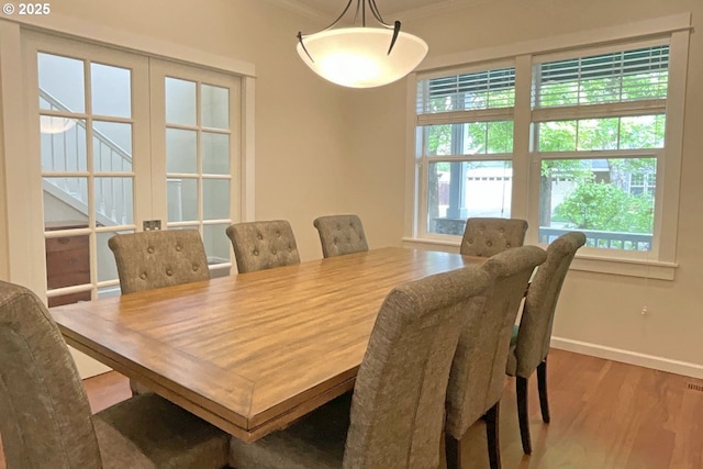 419 Salty Way, Eugene, OR 97404 - dining room featuring wood finished floors, baseboards, and ornamental molding
