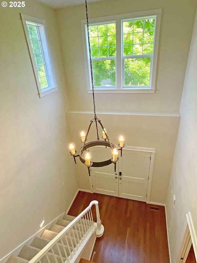 419 Salty Way, Eugene, OR 97404 - stairs featuring wood finished floors and a chandelier