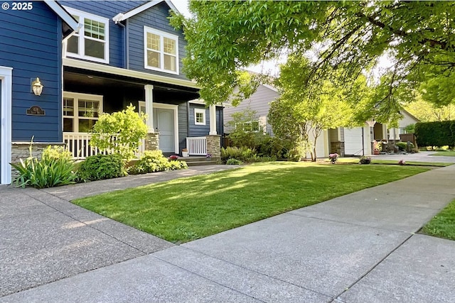 419 Salty Way, Eugene, OR 97404 - view of front of property with a front lawn, covered porch, and stone siding