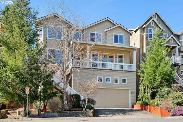 view of front of house featuring a garage, board and batten siding, and driveway