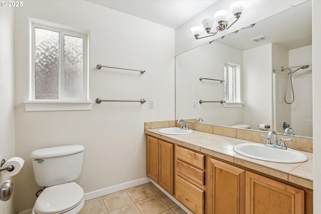 full bathroom featuring a sink, toilet, double vanity, and visible vents