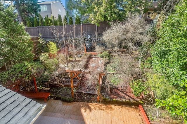 view of yard featuring fence and a wooden deck