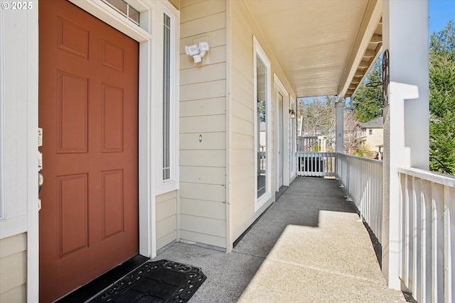 view of exterior entry featuring a porch