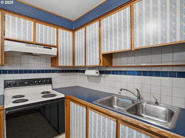 6103 SE 83rd Ave, Portland, OR 97266 - kitchen featuring electric range oven, under cabinet range hood, decorative backsplash, dark countertops, and wallpapered walls