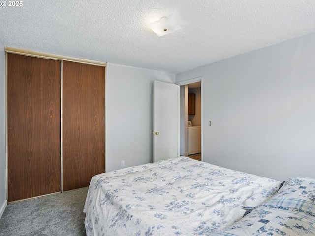 6103 SE 83rd Ave, Portland, OR 97266 - bedroom with a closet, carpet floors, a textured ceiling, and washer / dryer