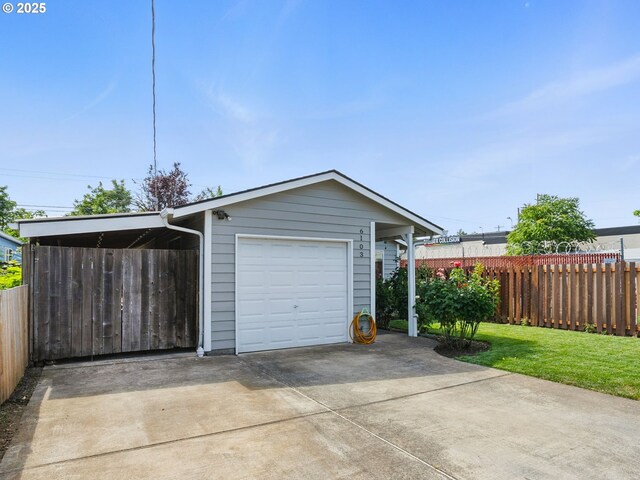 6103 SE 83rd Ave, Portland, OR 97266 - garage with concrete driveway and a carport