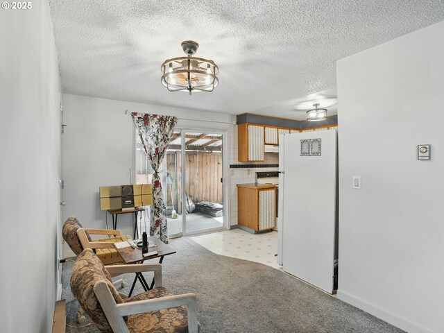 6103 SE 83rd Ave, Portland, OR 97266 - living area featuring a textured ceiling and light colored carpet
