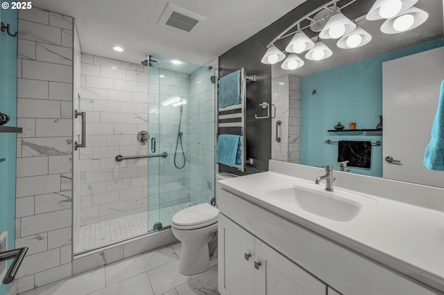 2393 SW Park Pl Unit 113, Portland, OR 97205 - bathroom featuring marble look tile flooring, vanity, a shower stall, and toilet