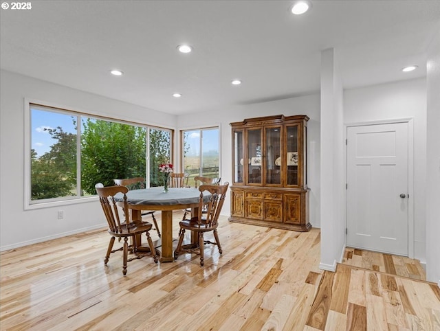 dining area with light wood-style flooring, recessed lighting, and baseboards