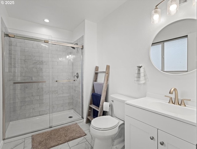 bathroom featuring a shower stall, vanity, marble finish floor, and toilet