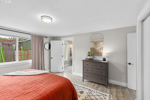 6696 Doral Dr SE, Salem, OR 97306 - bedroom with baseboards and light wood-style flooring