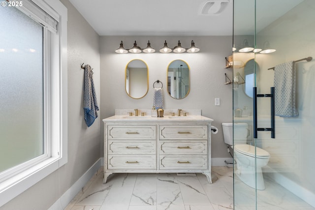 6696 Doral Dr SE, Salem, OR 97306 - full bathroom featuring marble look tiles, toilet, double vanity, and baseboards