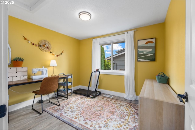 6696 Doral Dr SE, Salem, OR 97306 - office featuring wood finished floors, baseboards, and a textured ceiling