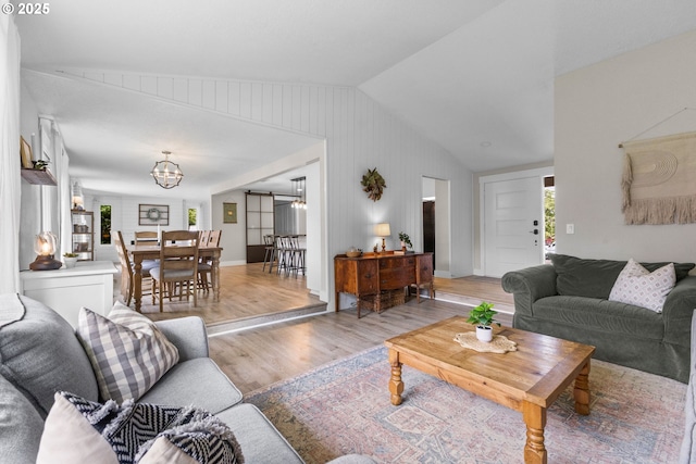6696 Doral Dr SE, Salem, OR 97306 - living room featuring light wood-type flooring, a chandelier, and vaulted ceiling