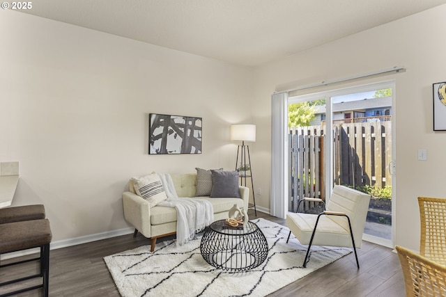 living room featuring wood finished floors and baseboards