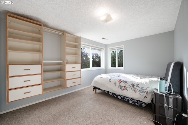 1412 SW Chastain Ave, Gresham, OR 97080 - carpeted bedroom with a textured ceiling and baseboards