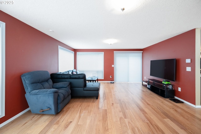 1412 SW Chastain Ave, Gresham, OR 97080 - living room featuring light wood-style flooring and plenty of natural light