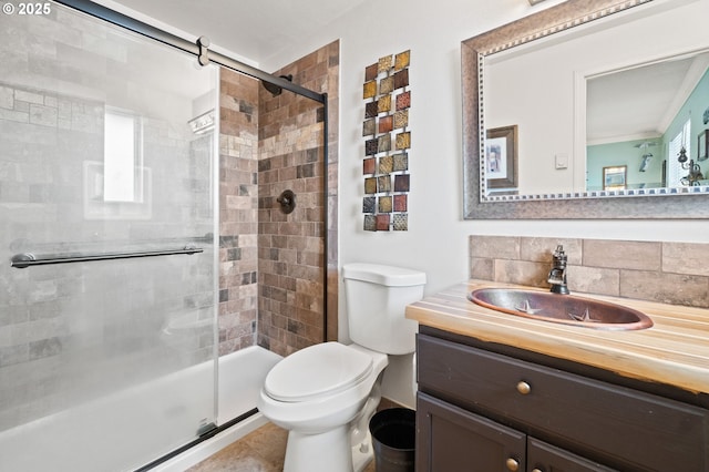 bathroom featuring decorative backsplash, tile patterned flooring, vanity, an enclosed shower, and toilet