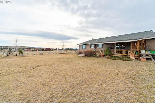 view of yard with a wooden deck