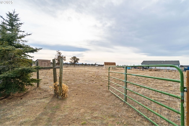 view of yard with a rural view