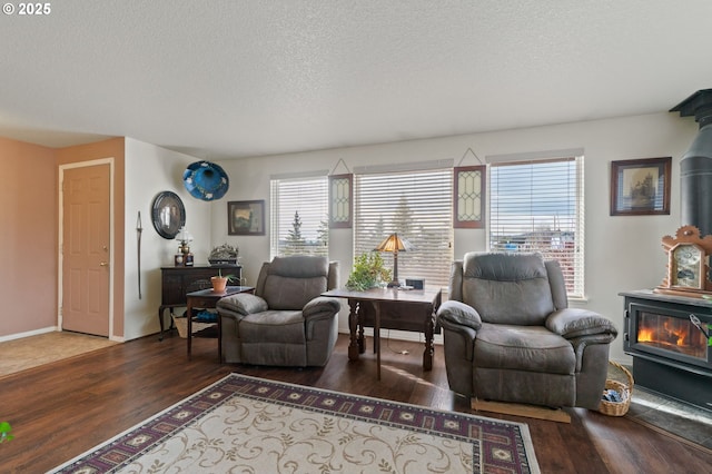 living room featuring dark hardwood / wood-style flooring and a textured ceiling