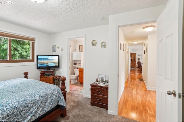 2202 NE 203rd Ave, Fairview, OR 97024 - bedroom featuring a textured ceiling and connected bathroom