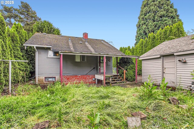 6861 N Sky St, Portland, OR 97203 - back of property with a chimney