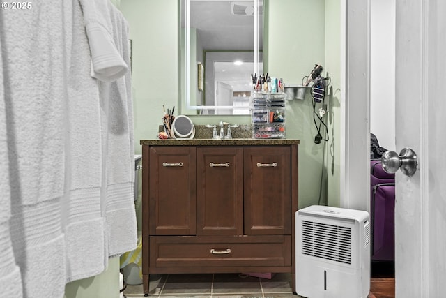 bathroom featuring tile patterned floors and vanity