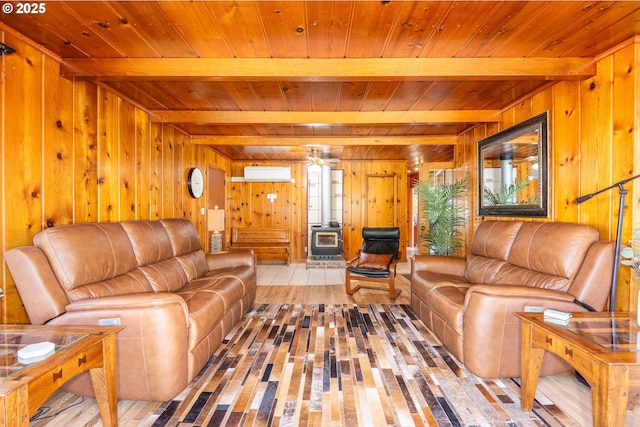 living room featuring beam ceiling, a wall mounted AC, and wooden ceiling