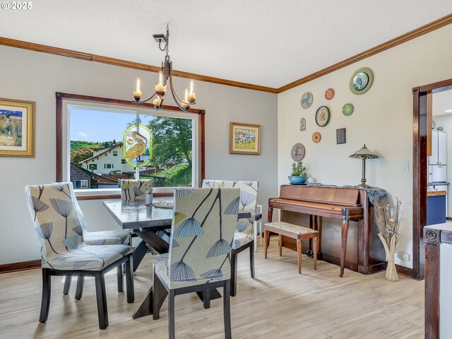 91196 Youngs River Rd, Astoria, OR 97103 - dining space featuring a chandelier, ornamental molding, light wood-style flooring, and a textured ceiling