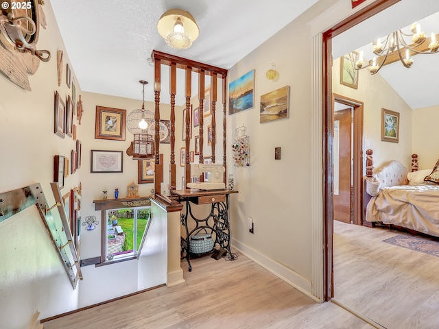 91196 Youngs River Rd, Astoria, OR 97103 - hallway featuring wood finished floors and a chandelier