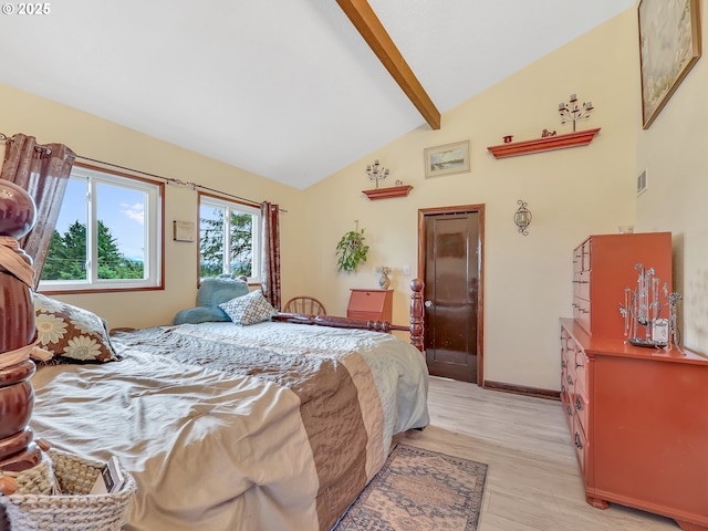 91196 Youngs River Rd, Astoria, OR 97103 - bedroom with light wood-type flooring, beam ceiling, and high vaulted ceiling