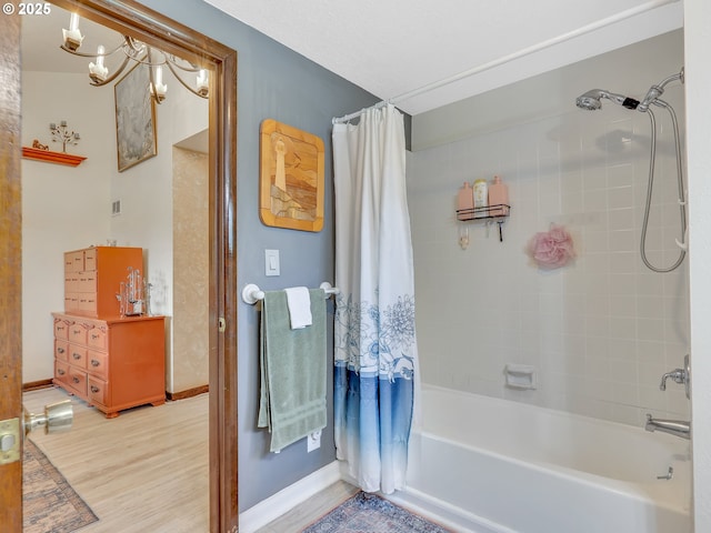 91196 Youngs River Rd, Astoria, OR 97103 - full bath featuring shower / tub combo, wood finished floors, and a chandelier