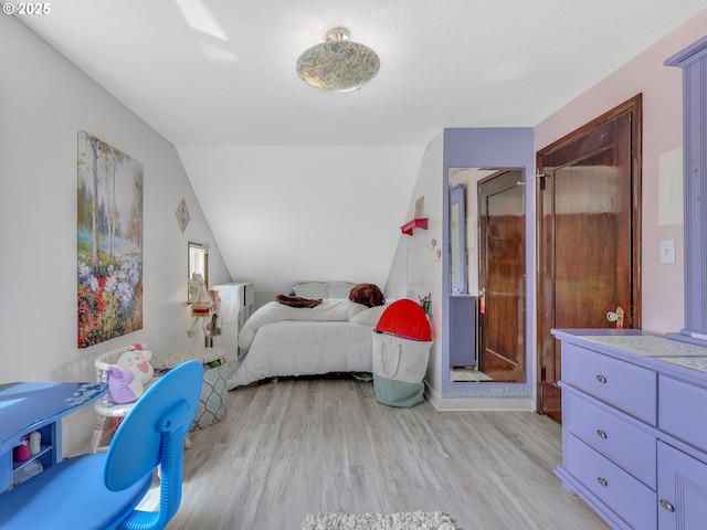 91196 Youngs River Rd, Astoria, OR 97103 - bedroom featuring light wood-type flooring and vaulted ceiling