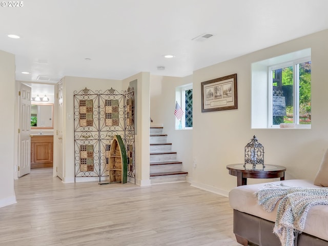 91196 Youngs River Rd, Astoria, OR 97103 - sitting room with light wood-type flooring, recessed lighting, and stairway