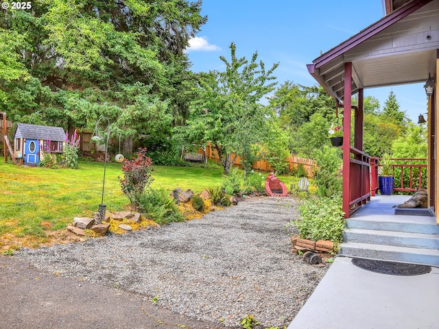 91196 Youngs River Rd, Astoria, OR 97103 - fenced backyard featuring a shed and view of wooded area
