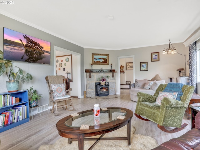 91196 Youngs River Rd, Astoria, OR 97103 - living area featuring wood finished floors, a chandelier, and ornamental molding