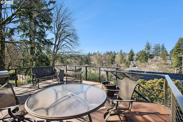 wooden deck featuring outdoor dining space
