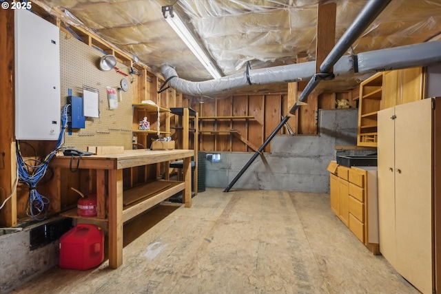 unfinished below grade area featuring a workshop area