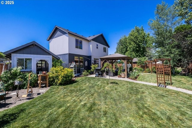 rear view of house featuring a playground, fence, a gazebo, a yard, and a patio area