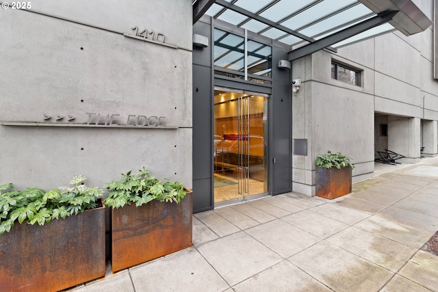 property entrance featuring a patio area